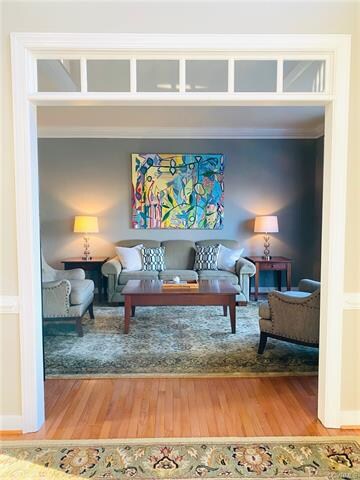 Formal Living Room has beautiful glass transom win