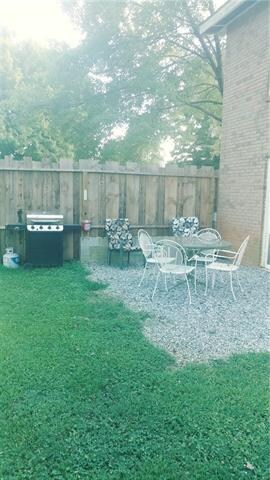 patio area with privacy fence