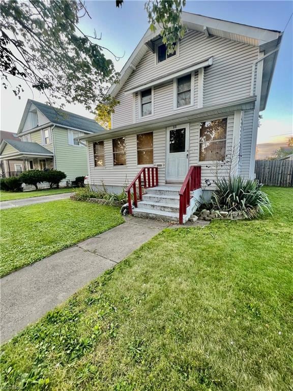 View of front of property with a yard