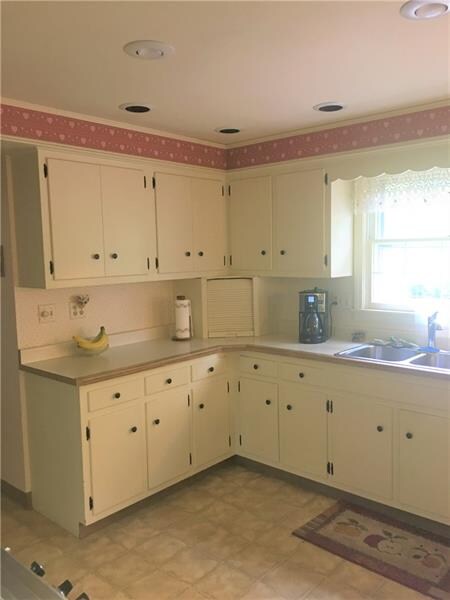 Large eat-in kitchen boasts stainless steel applia