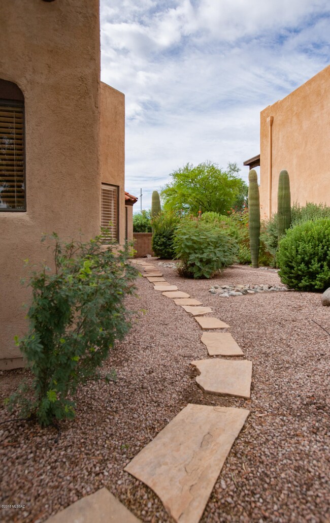 flagstone path leads to backyard