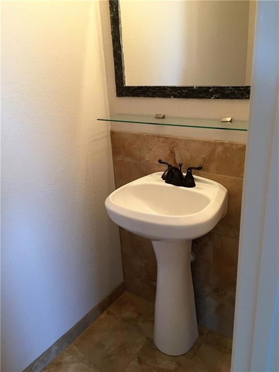 Half bath opposite Dining room/Living Room. New Ti
