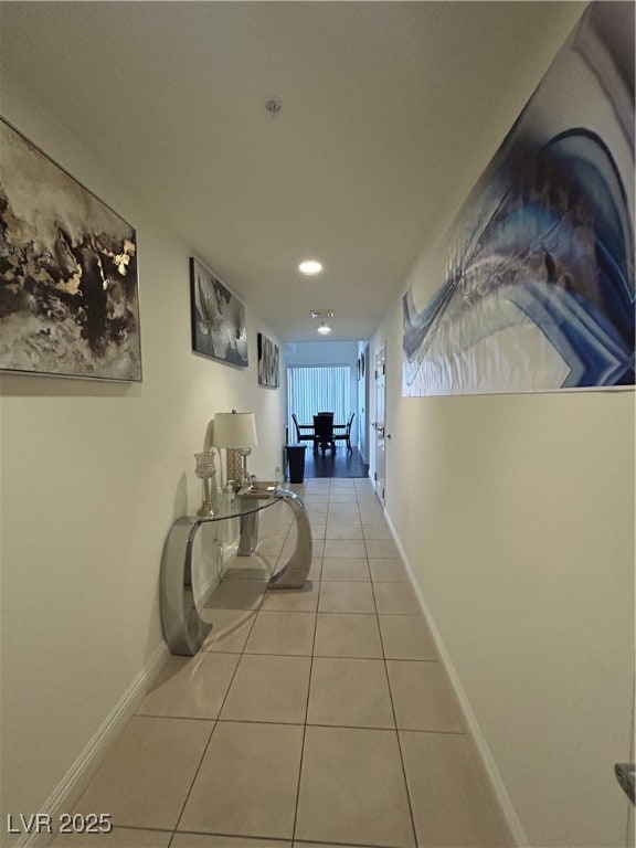 Hall featuring tile patterned floors and recessed lighting