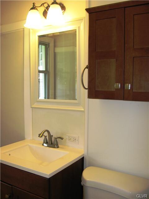 Updated bathroom with new fixtures and tile floori