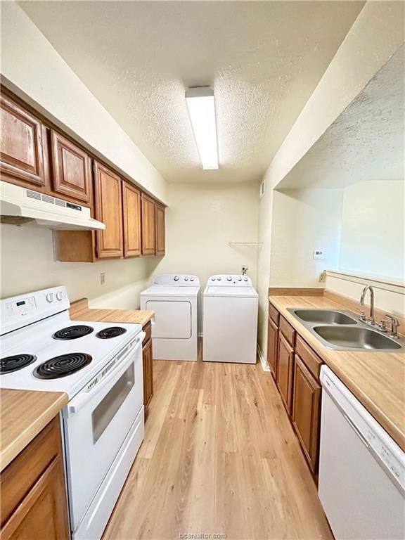 Kitchen featuring light wood-type flooring, a text