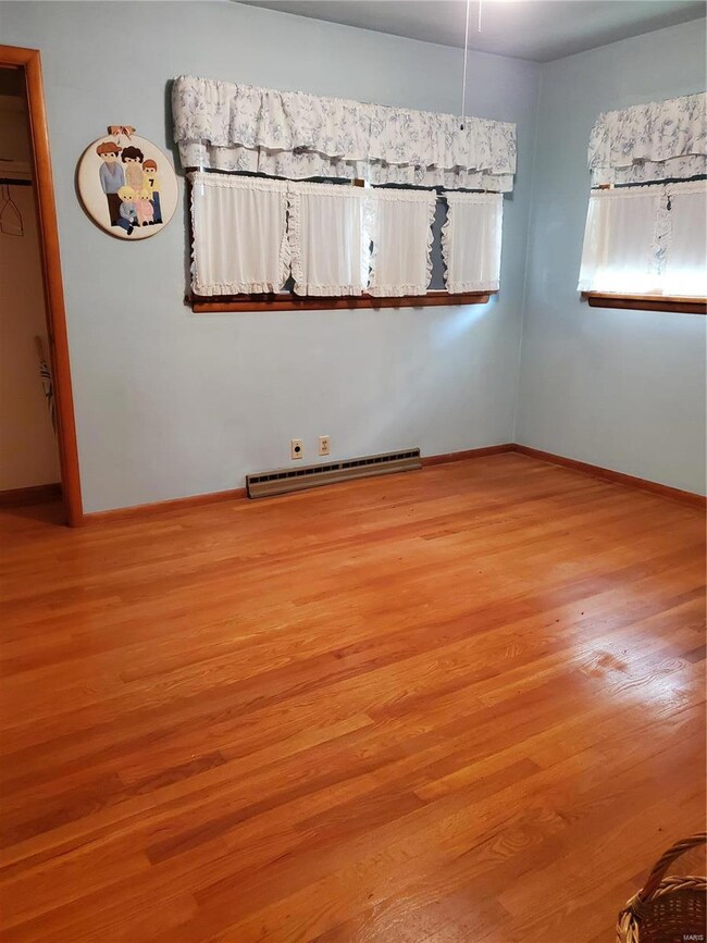 Front bedroom with double closets & hardwood floors