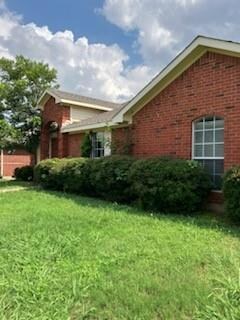 View of home's exterior featuring a lawn