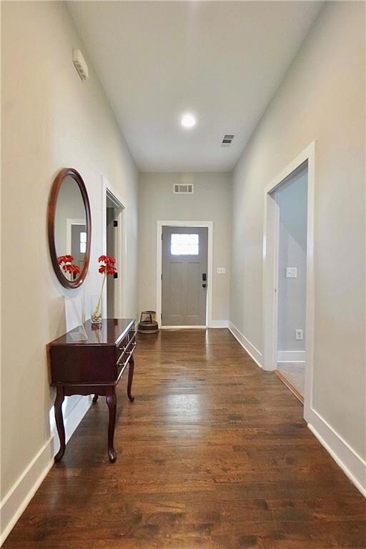 Entrance foyer featuring visible vents, baseboards