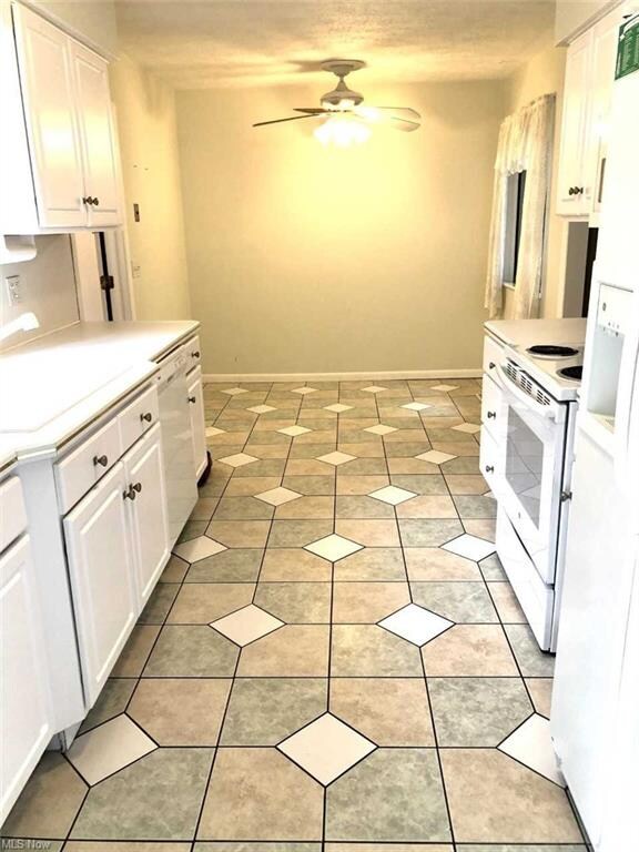 another view of kitchen, nice eating area space at the end.