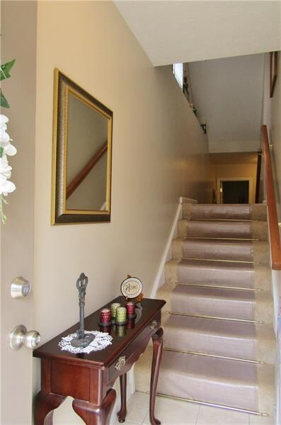 FRESH, NEUTRAL PAINT, CARPET AND TILE WELCOME YOU 