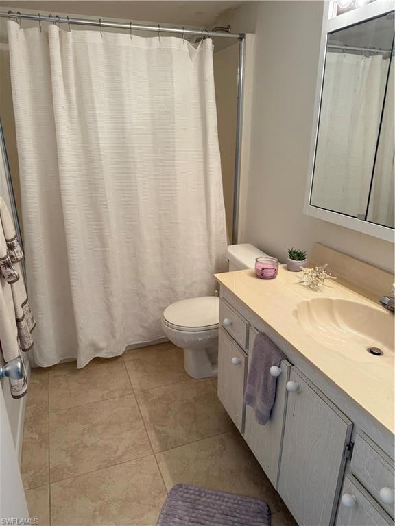 Bathroom featuring vanity and tile patterned floors