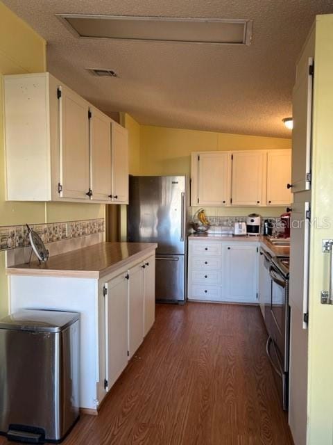 VIEW OF KITCHEN FROM DINING AREA