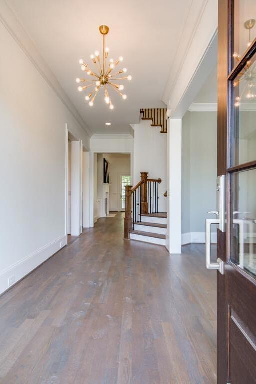Inviting foyer with custom stained floors