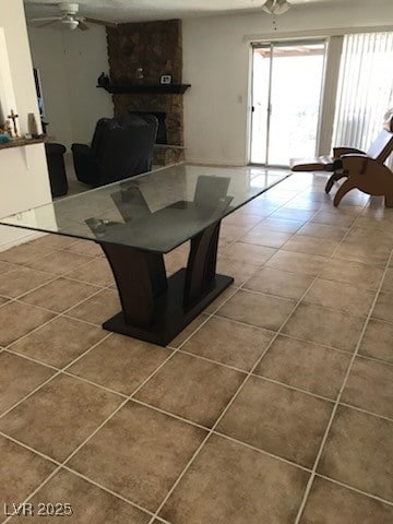 Tiled living room featuring ceiling fan, plenty of