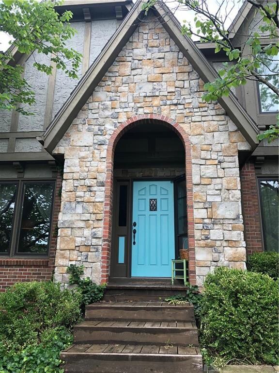 The happy turquoise door welcomes you to 5013 Summ