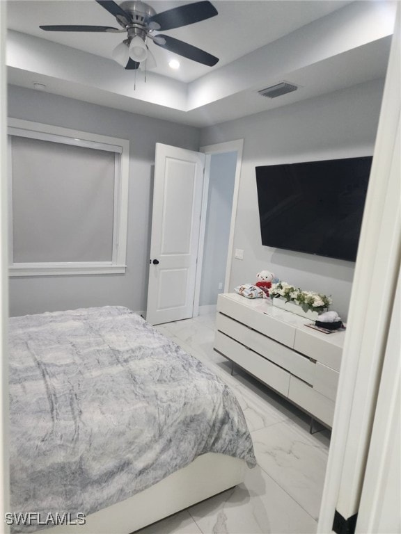 Bedroom featuring marble finish floors, recessed l