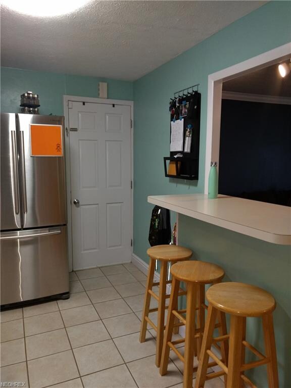 View of kitchen showing breakfast bar and entry do