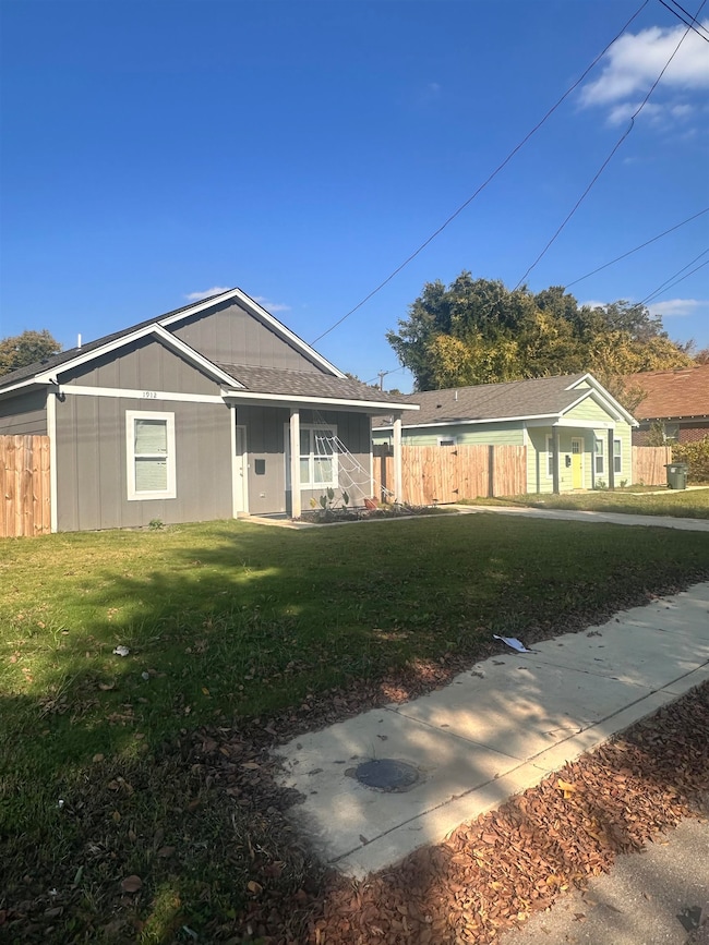 Ranch-style home with roof with shingles and covered porch