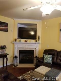 Bright and warm Gas Log Corner Fireplace with Large TV Niche