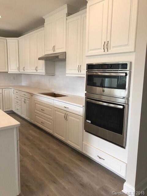 Gas cooktop with wall and convection oven