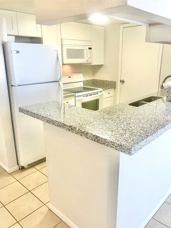 Breakfast bar, dishwaher, microwave, double sink.