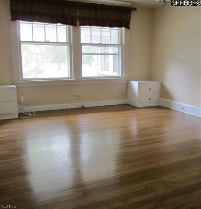 WEST UNIT DINING ROOM WITH REFINISHED HARDWOOD FLOORS