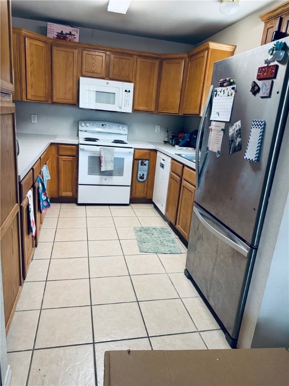 Kitchen with light countertops, light tile pattern