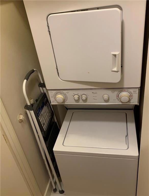 Laundry area featuring stacked washer / drying ma