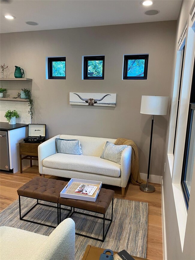Living area featuring recessed lighting, baseboar
