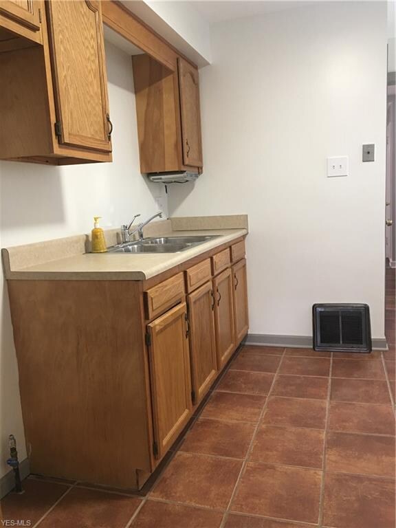Kitchen view, with a convenient door to driveway t