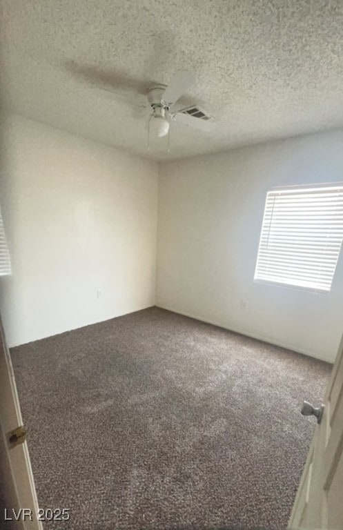 Bedroom with carpet and a ceiling fan.