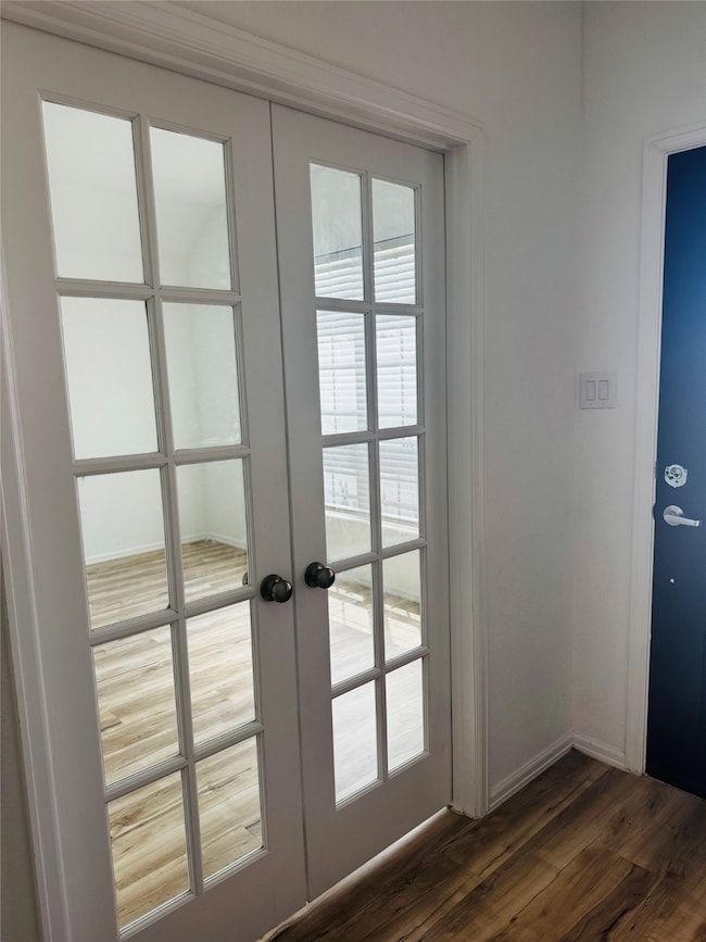 This photo features a bright room with glass-panel