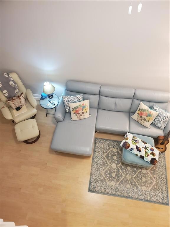 VIEW INTO FAMILY ROOM FROM UPSTAIRS LOFT