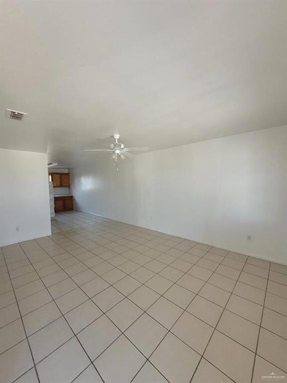 Unfurnished room featuring ceiling fan