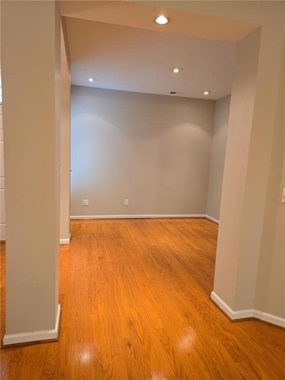 Dining room featuring baseboards, visible vents, and wood finished floors