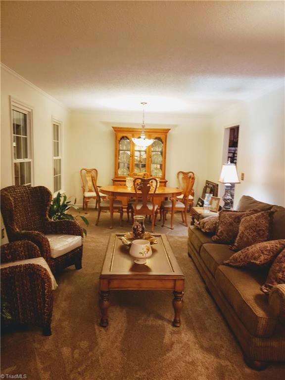 Enter into the foyer and to your right is this spacious formal living and dining area