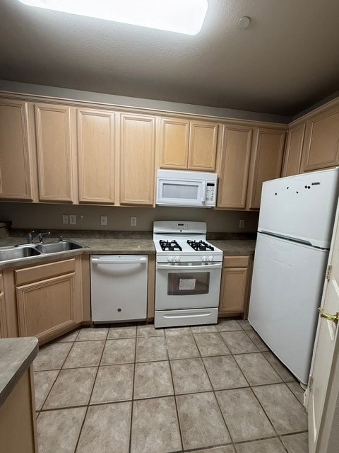 Kitchen featuring light brown cabinets,