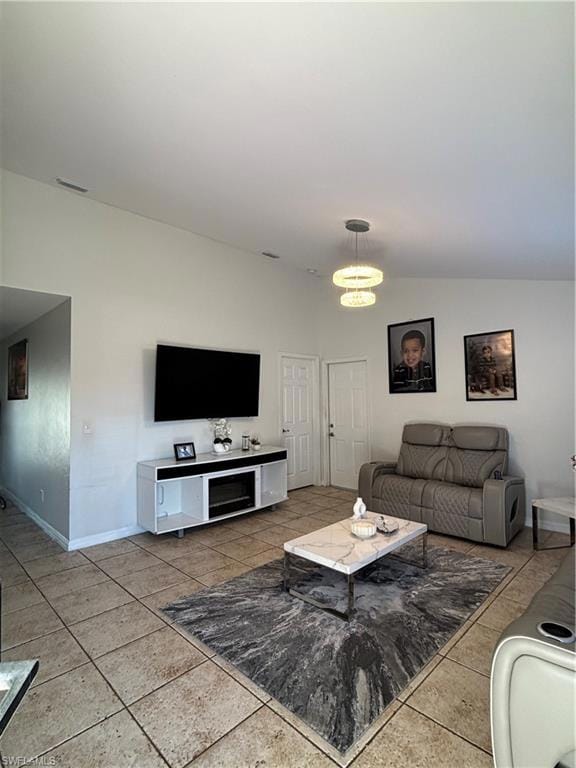 Living area featuring visible vents, baseboards, a