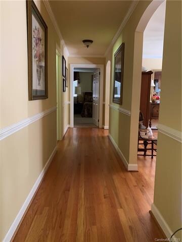 Hardwood floors down the hallway and into dining r
