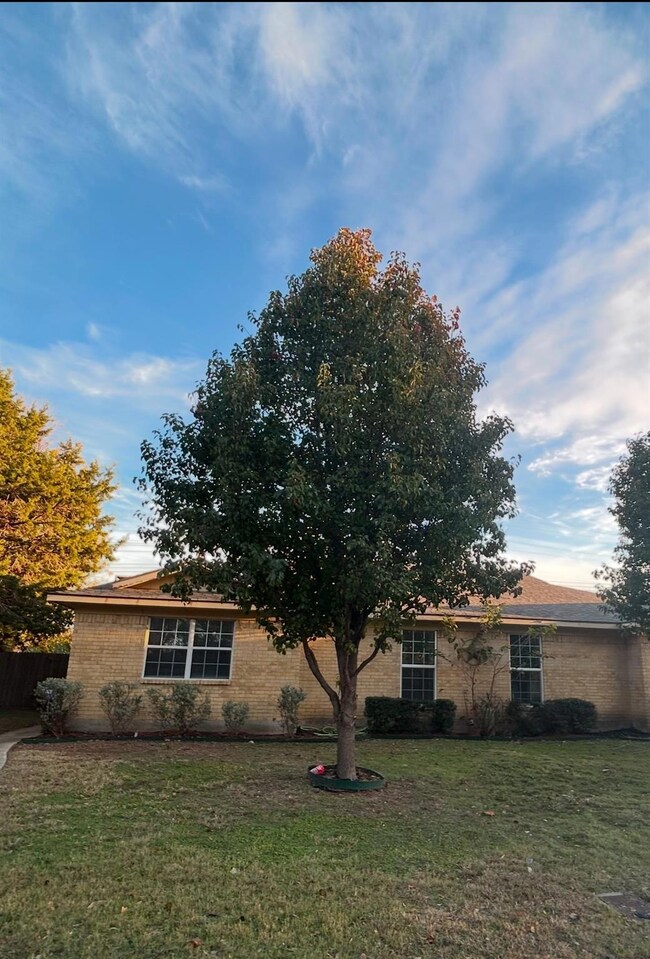 View of home's exterior with a yard