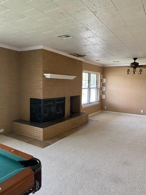 Unfurnished living room featuring ornamental molding, carpet floors, a ceiling fan, and billiards table