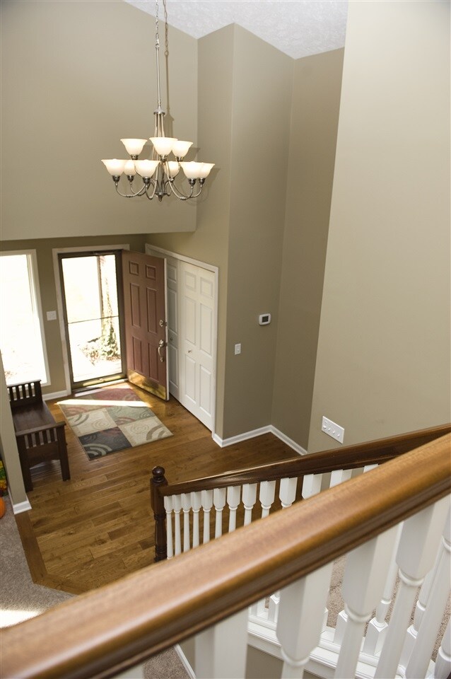 2 Story entry; oak floors and 2-tone spindled hand