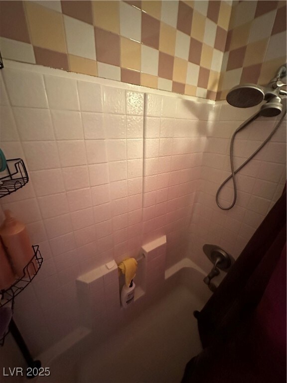 Full bathroom featuring shower / bath combo with shower curtain