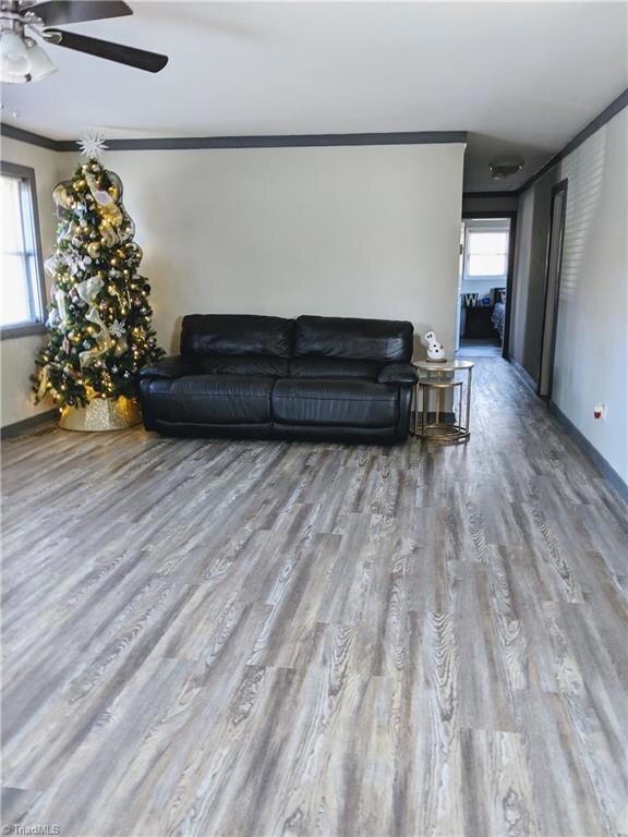 Living room with new LVP, fresh paint, and trim.
