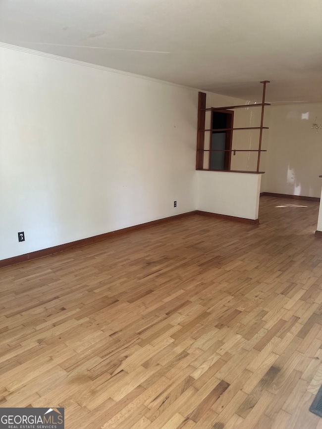 Floors have been recently refinished in the living room.