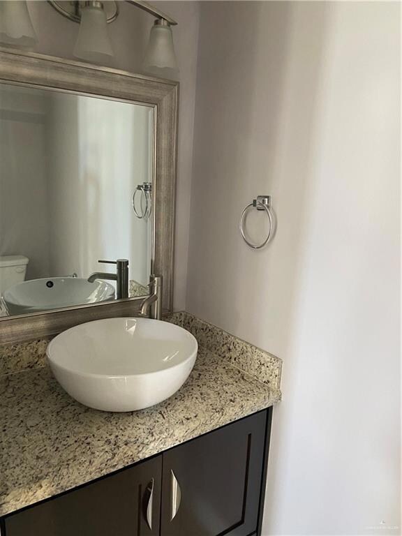 Bathroom featuring vanity and toilet
