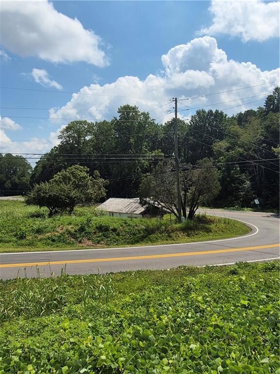 Surrounding community with view of wooded area