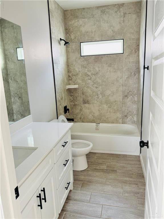 Full bath with vanity, shower / washtub combination, and wood finish floors