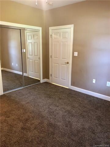 Master bedroom and mirrored closet.