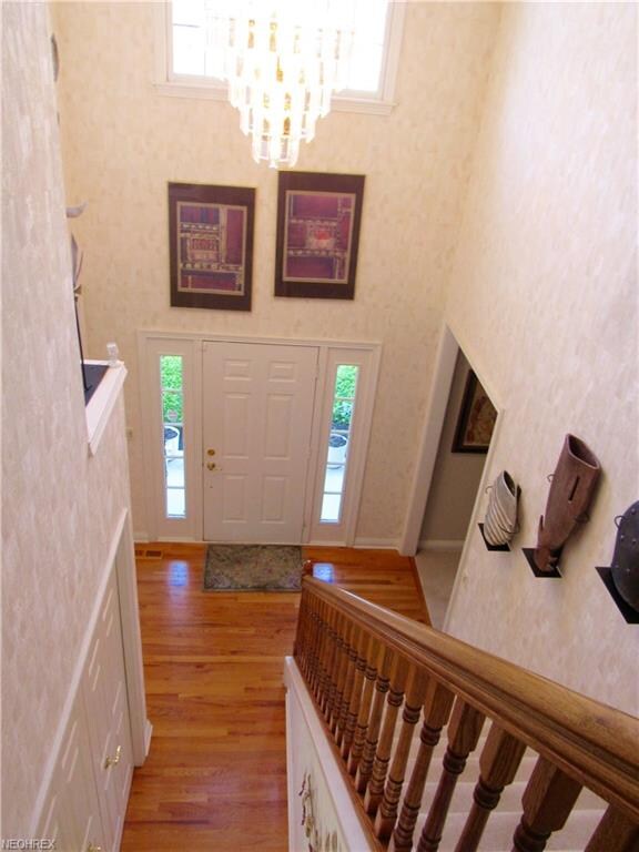 Wide open two-story foyer with beautiful hardwood 